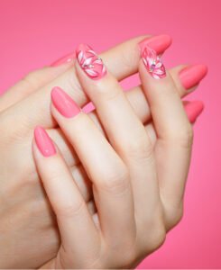 close up manicured woman s nails with pink nail art 1 (1)